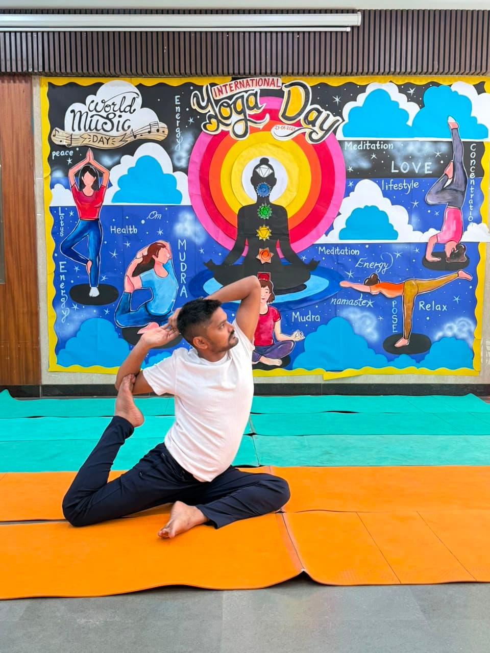 Yoga teacher in tree pose during a studio class